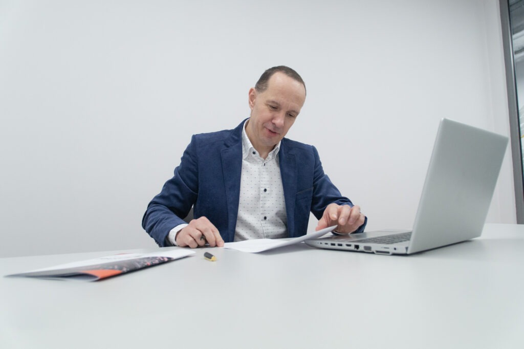 Tronel CEO, Marcin Żyrkowski at a desk