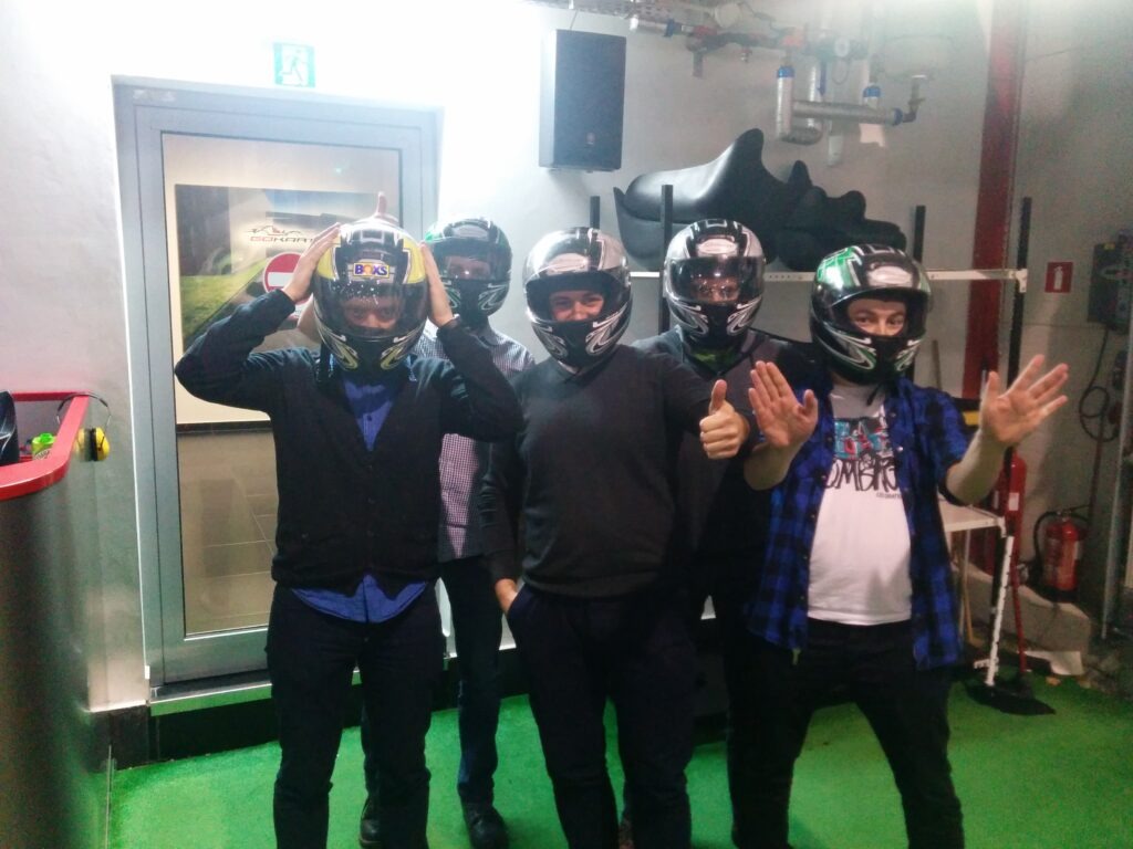 Group of Tronel employees at a team building event at a karting center
