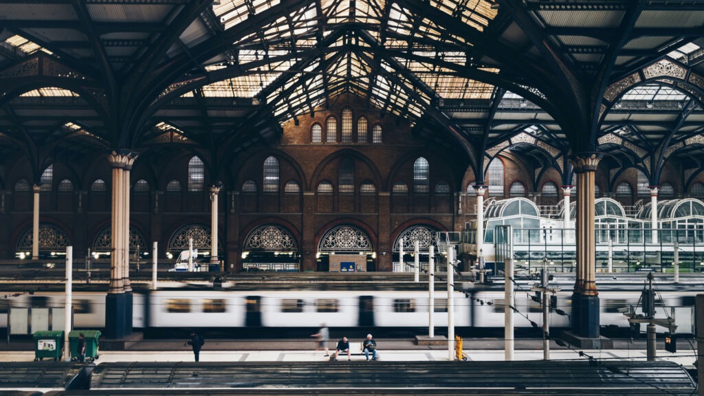 Railway station with a departuring train