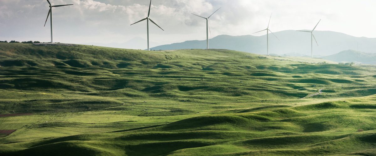 Energy-efficient and sustainable wind turbines on a green hill